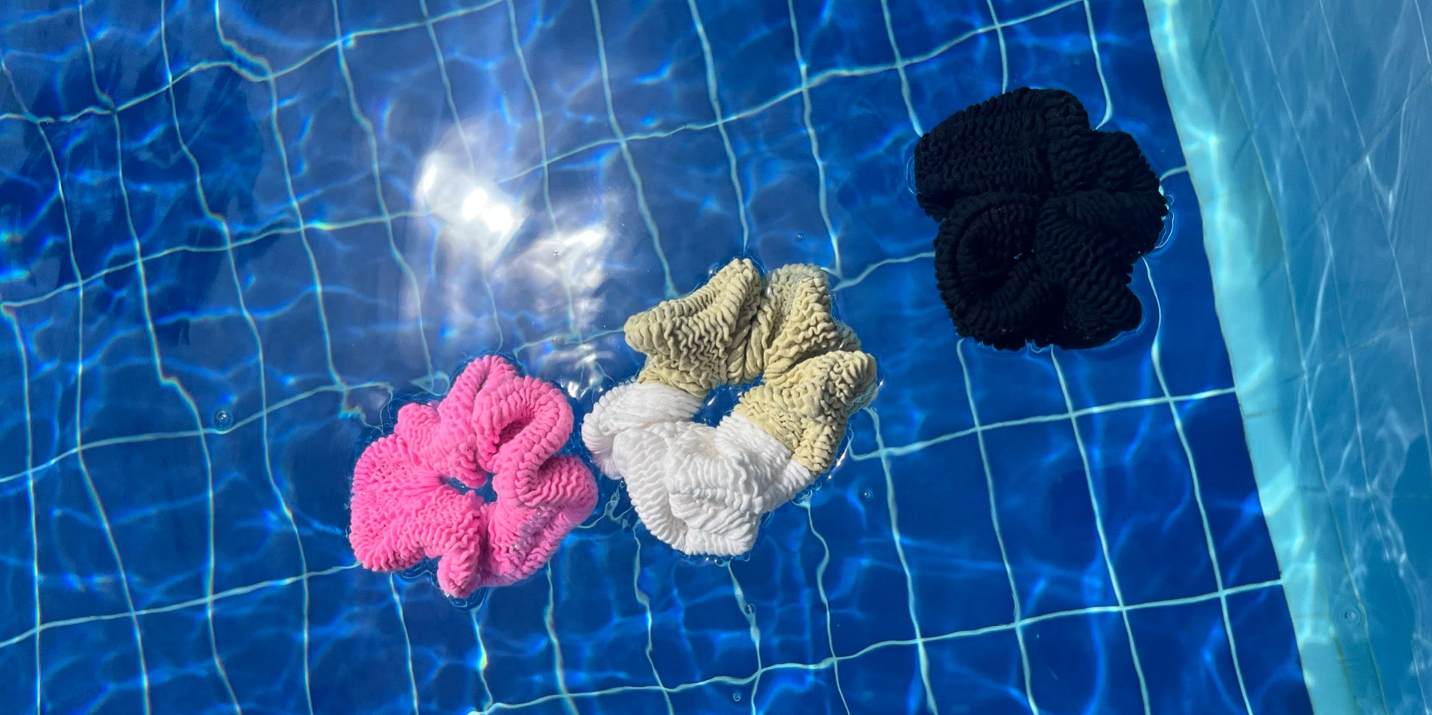 Crinkle scrunchies floating in the swimming pool 