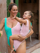 Mum and daughter matching in crinkle swimsuits 