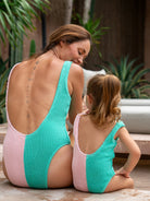 Mum and daughter matching in crinkle swimsuits