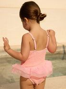 Back of Tulla Kids Swimsuit with 3-tier tutu, silver-detail adjustable straps, luxurious crinkle fabric