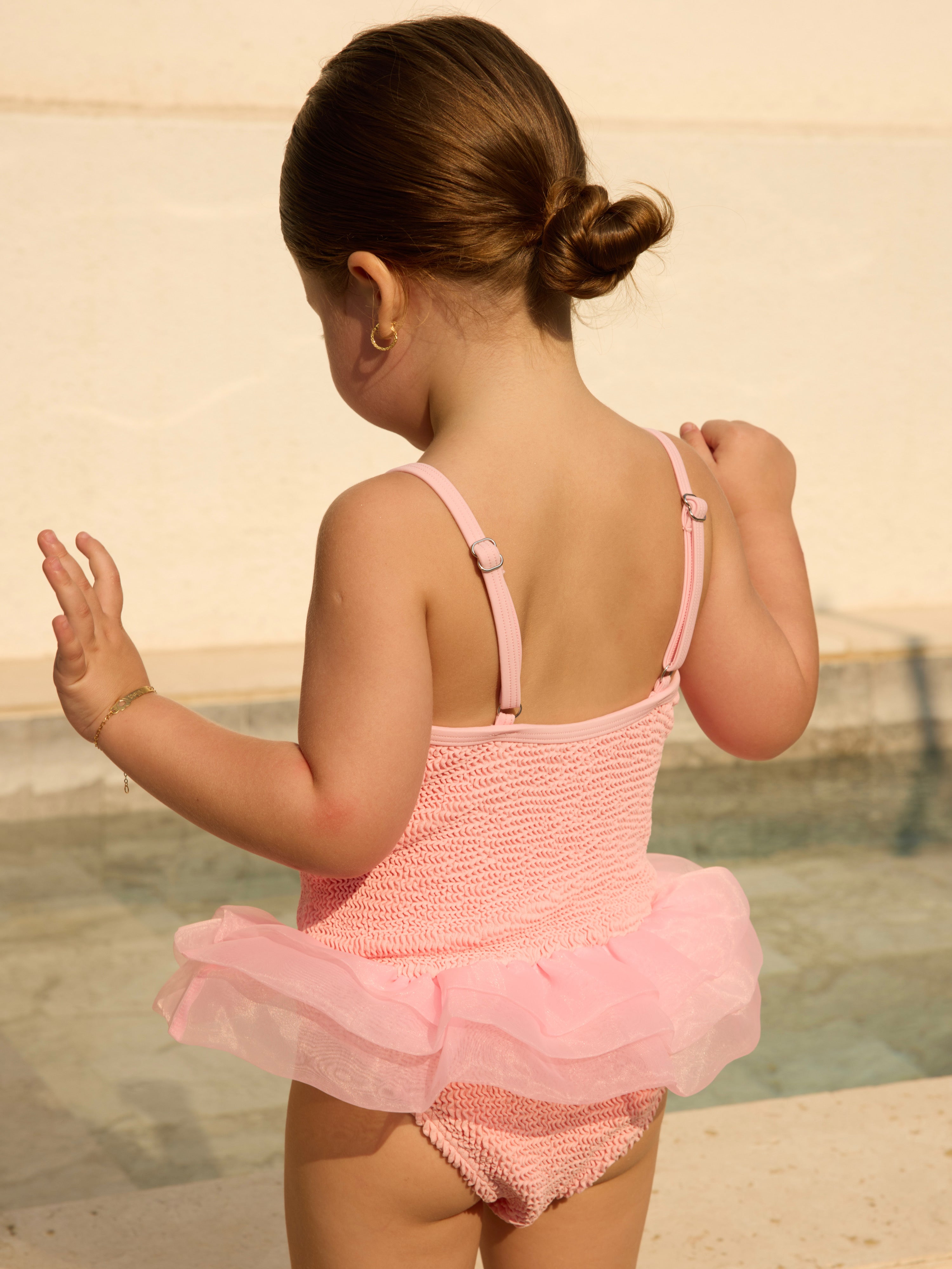 Back of Tulla Kids Swimsuit with 3-tier tutu, silver-detail adjustable straps, luxurious crinkle fabric